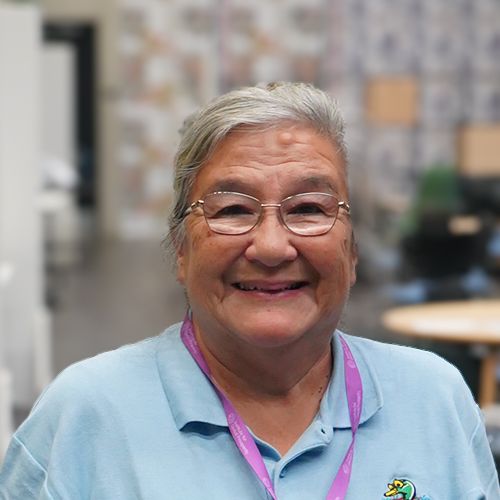 Teresa Tunnicliffe - a late middle aged lady with silver grey hair, wearing a blue top.